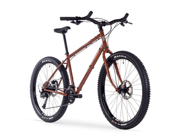 Boreal | All Terrain Touring Bike angled view showing knobby tires, disc brakes, and sturdy frame on white background