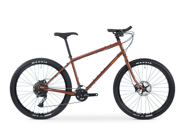 Boreal | All Terrain Touring Bike in rust color with durable frame, disc brakes, and knobby tires on white background