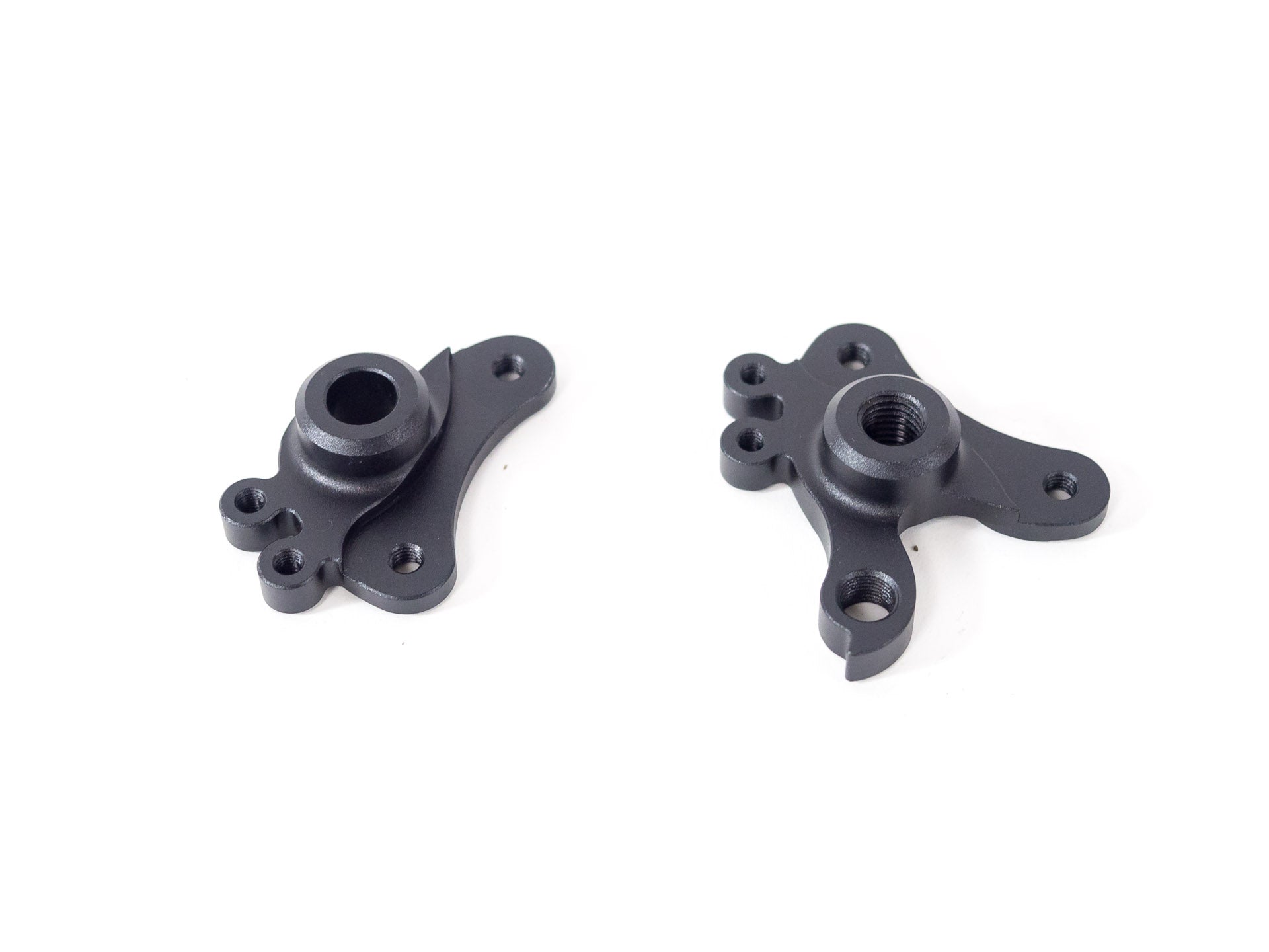 Forillon - Dropout parts shown in close-up on a white background highlighting detailed machining and mount points